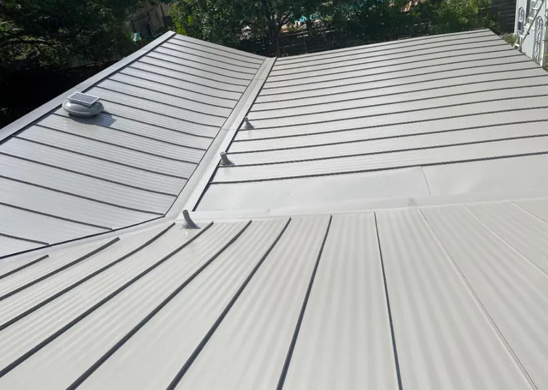Solar attic fan installed on a metal roof for Roof Ventilation in Rehoboth